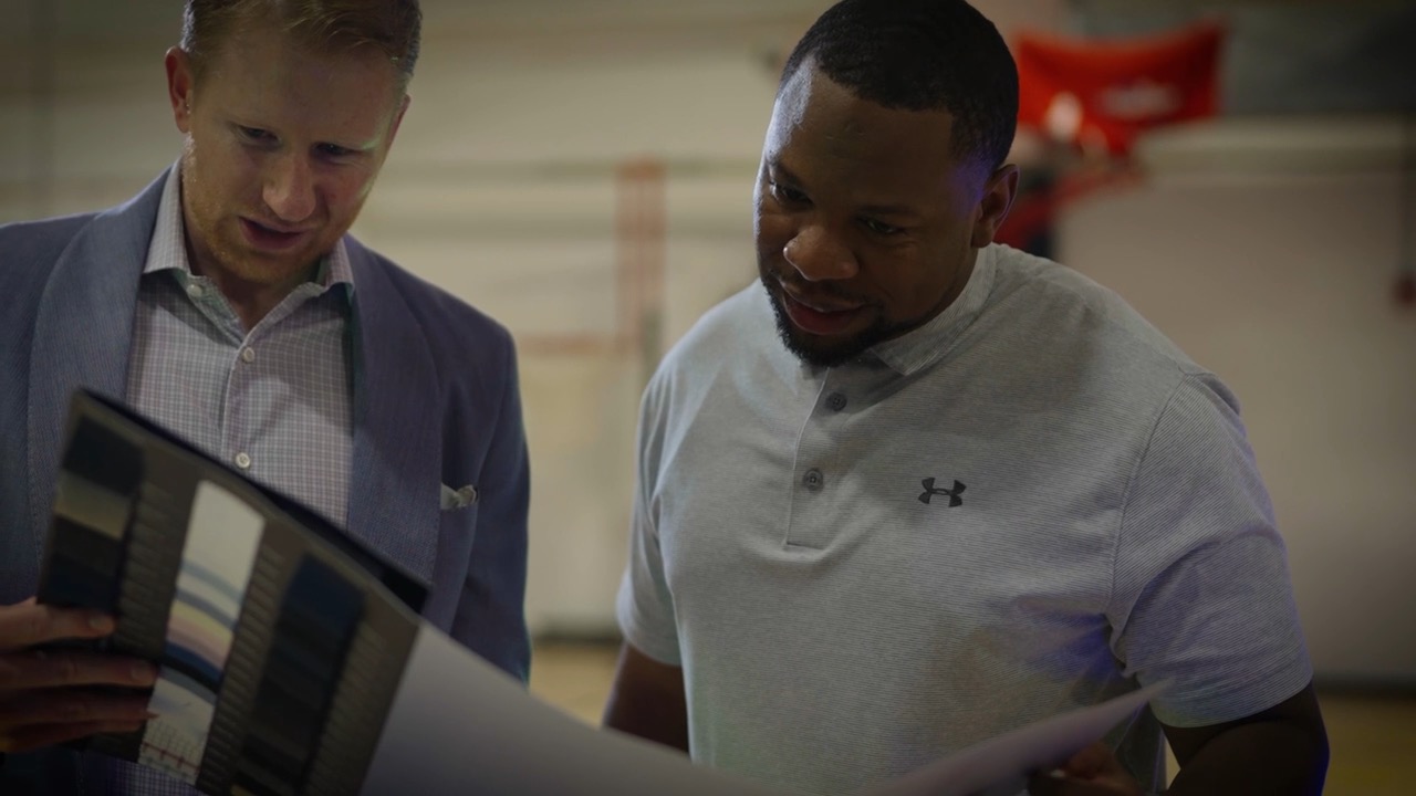 Daniel Wiebracht and a client reviewing fabric selections together
